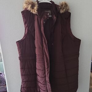 Maurices Burgundy Puffer Vest With Fur Trimmed Hood.